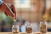 Money-jars-Rido-shutterstock_2341161137