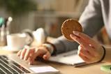 person-eating-cookie-shutterstock_1765695494