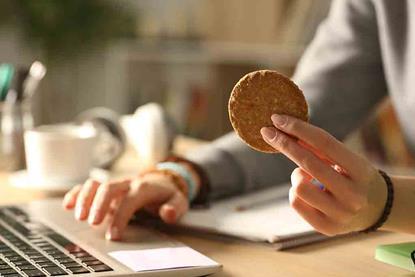 person-eating-cookie-shutterstock_1765695494