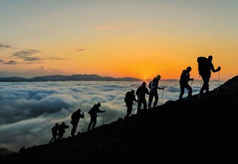 Silhouettes of hikers At Sunset