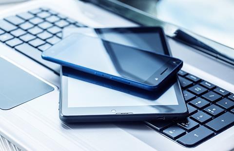 Laptop with tablet and smartphone on white background