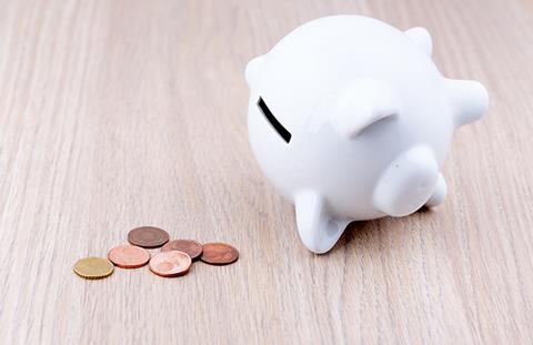 Piggy bank pennies M2K7 shutterstock 377585926