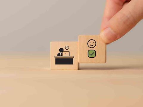 Wooden blocks symbolising wellbeing and digital
