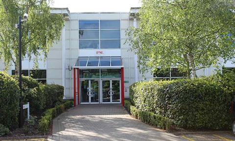 Image shows an external shot of office building with a sign above the door saying IPSL