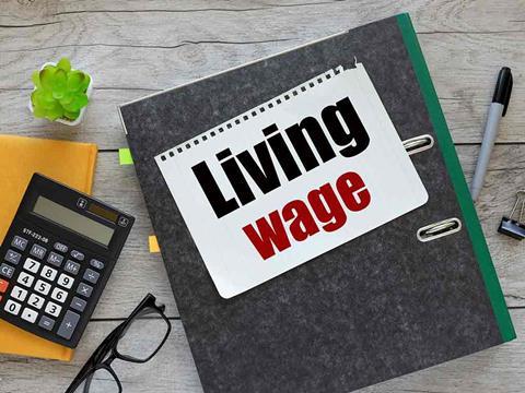 a notebook that says living wage