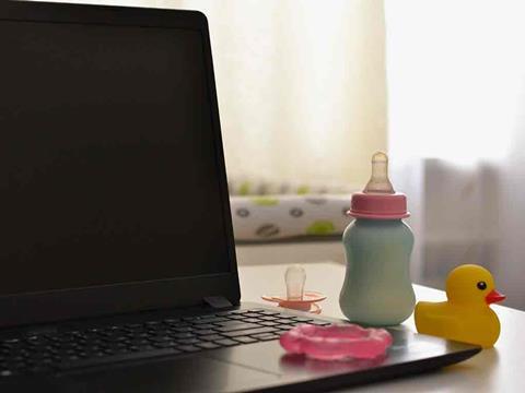 baby items next to a laptop