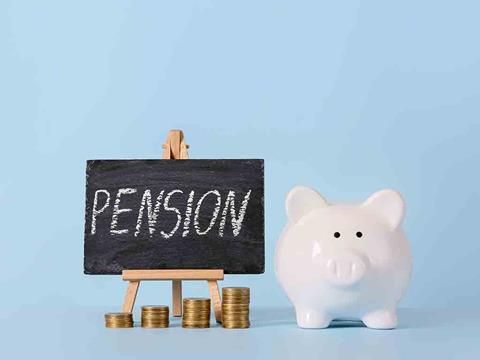 piggy bank and chalkboard sign that says pension