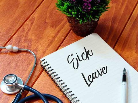 a notebook that says sick leave
