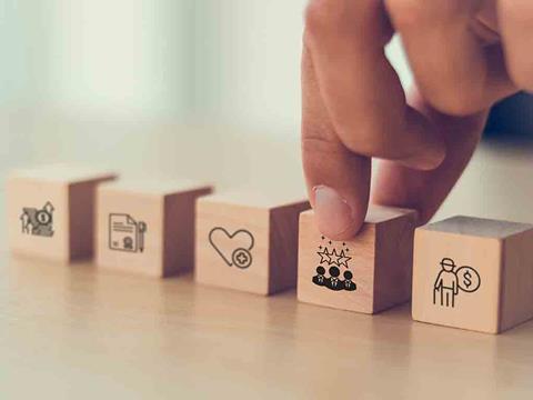 wooden blocks symbolising employee benefits