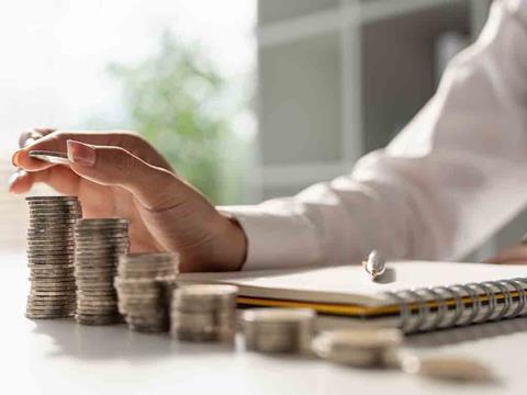 a woman with rows of coins