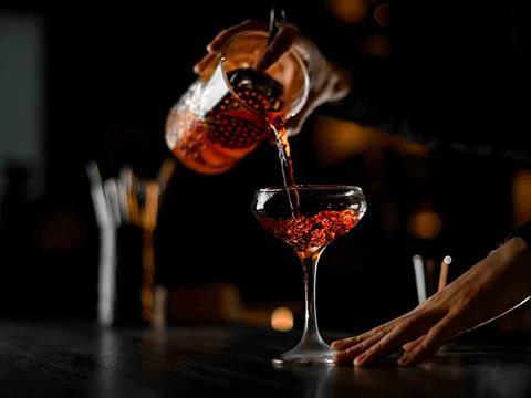 A bartender making a drink