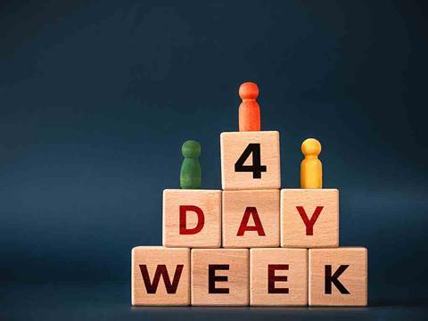wooden blocks saying four day week